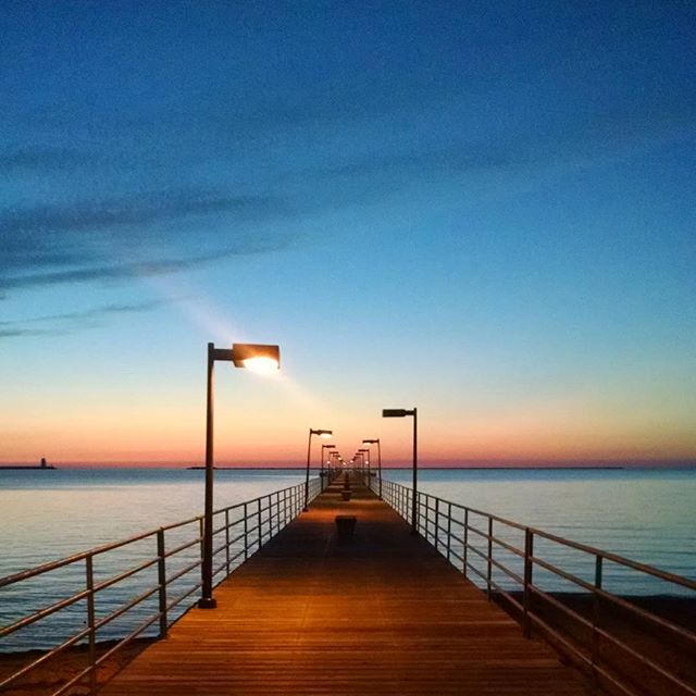 Image of Lake Huron viewed from a pier before sunrise