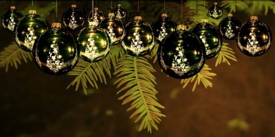 shiny ornaments hanging from a Christmas tree