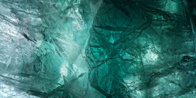 fluorite gem surface with a face embedded