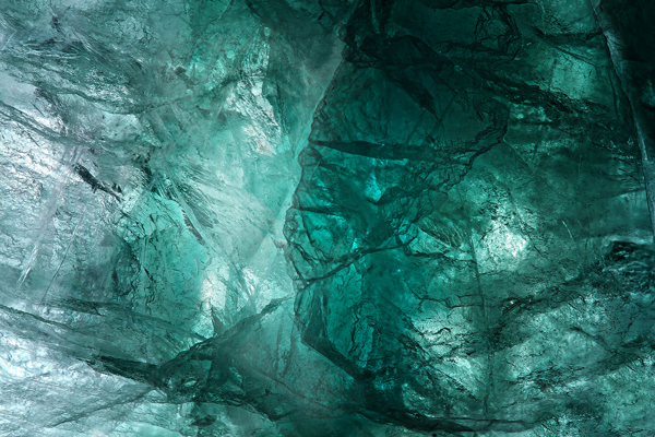 fluorite gem surface with a face embedded