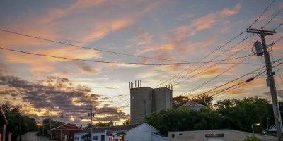 Local businesses and warehouses in downtown Waterville at sunset.