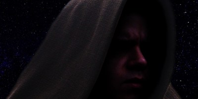 Cosplay image of a Star Wars Jedi set against a starry sky