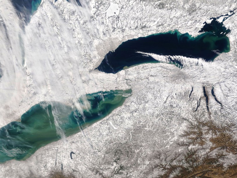 Lakes Erie and Ontario and the land around them covered in lake effect snow, as seen from space