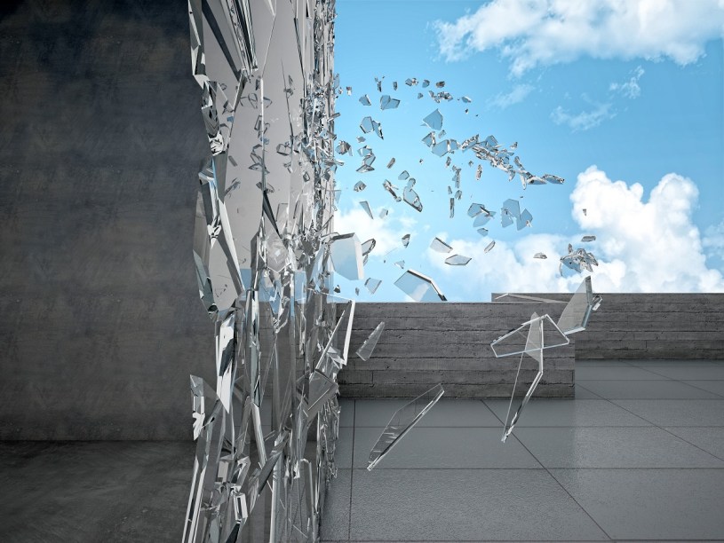 shattering glass exterior of a building