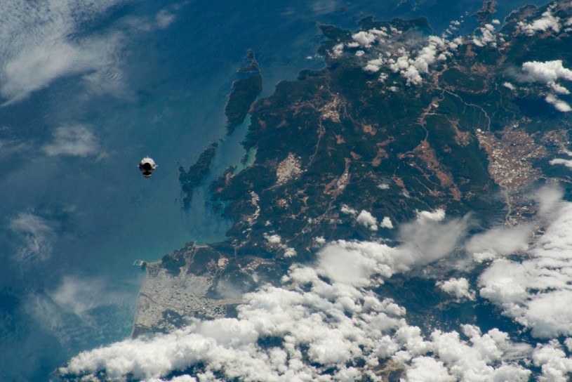 SpaceX Dragon capsule Endeavor flying over Earth
