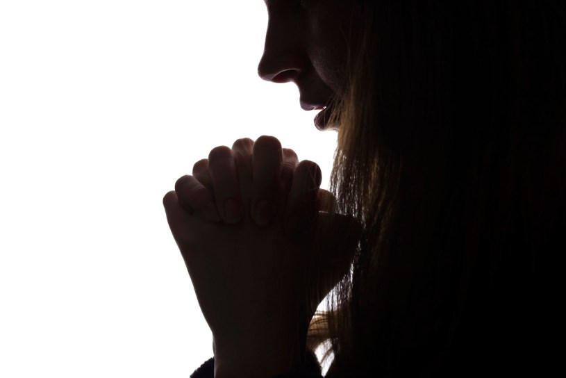 Young woman looking down, profile of a silhouette