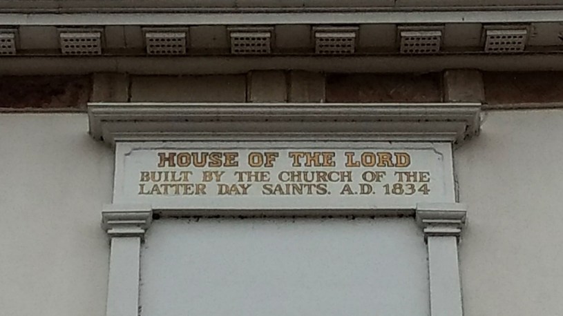 A sign on the front of the Kirtland Temple reading, "House of the Lord, Built by the Church of the Latter Day Saints. A.D. 1834