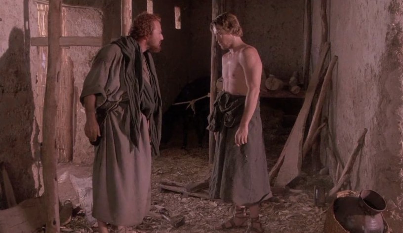 Judas and Jesus stand and argue in a scene from the movie The Last Temptation of Christ