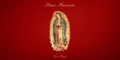 red background with the Virgin Mary in the center, for the cover of Alanis Morissette's recording of Ave Maria